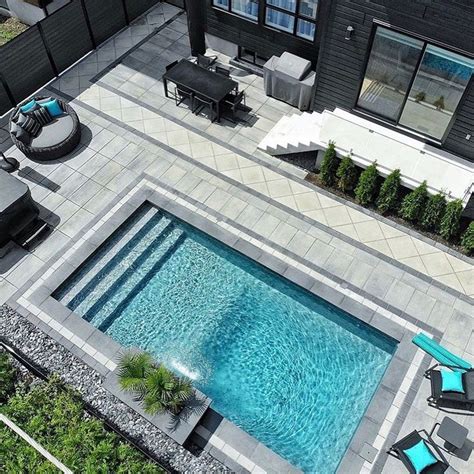 an aerial view of a pool and patio area