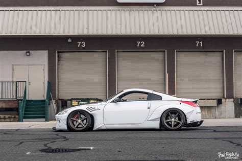 Out Of This World White Nissan 350Z Boasting Rocket Bunny Body Kit — CARiD.com Gallery