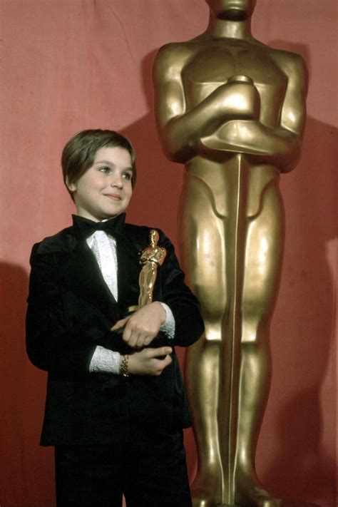 Ten-year-old Tatum O'Neal holding her Oscar after winning the Best ...