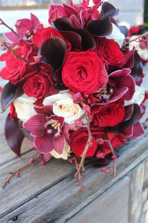 Rich Red and Ivory wedding bouquet with Calla Lily, Roses, Spider Orchids and Cymbidium Orchids ...