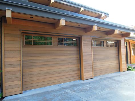 Wood flush insulated with custom cedar overlay and custom glass inserts | Wood garage doors ...