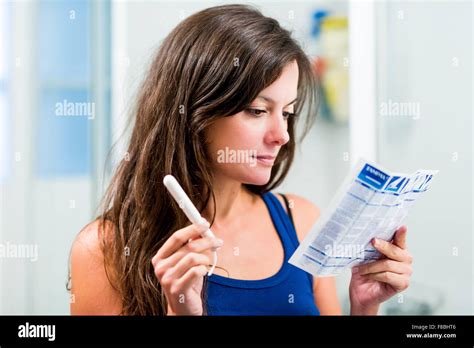 Teenage girl reading tampons instructions sheet Stock Photo - Alamy