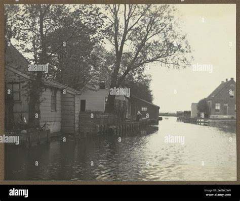 Houses on the Krommert in Amsterdam, Anonymous, c. 1910 - c. 1930 photograph Part of album with ...