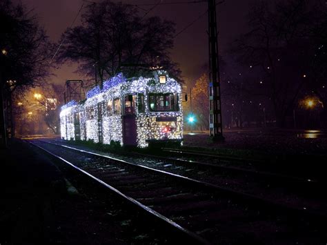 Wallpaper Budapest, Hungary, city, night, tram, road, rails, trees ...