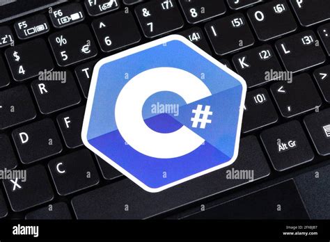 C#, C sharp programming language symbol, logo sticker, laying on a ...