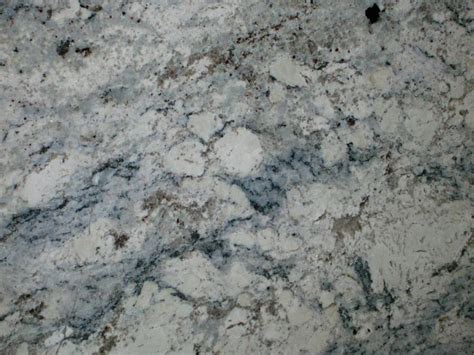 Grey and blue veining in a white ice granite slab - Decoist