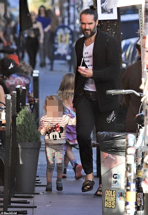 Russell Brand is every inch the doting dad as he takes toddler daughter Mabel for ice cream ...