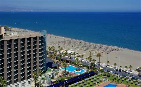 an aerial view of the beach and hotel