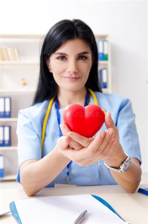 The Female Doctor Cardiologist Working in the Clinic Stock Photo ...