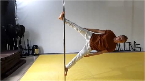 World Pole Champion Becomes a Human Flag Using Incredible Coordination and Strength