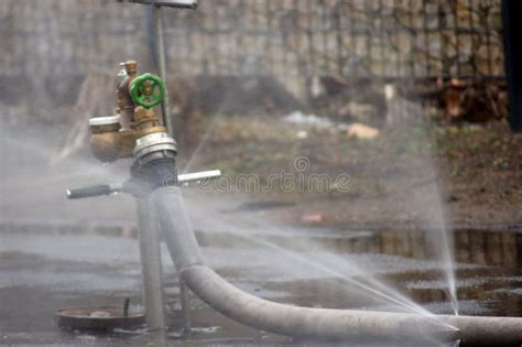 Water from the hydrant stock photo. Image of water, path - 136972424