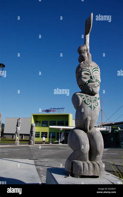 A wooden Maori statue in front of Te Rauparaha Arena, a community sport ...