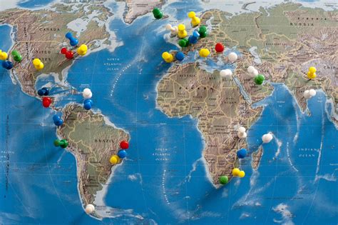 Free Stock Photo 10699 Multi Colored Thumb Tacks Inserted in World Map | freeimageslive