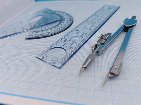 Premium Photo | Compass and protractor for math and engineers or ...