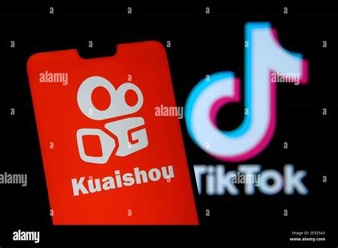 Kuaishou app logo seen on the smartphone screen and blurred background with TikTok logo. Popular ...