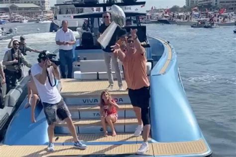 Watch: Tom Brady throws Super Bowl trophy at boat parade party ...