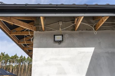 The Light for the Motion Sensor Mounted on the Facade of the Building Above the Garage Door in ...