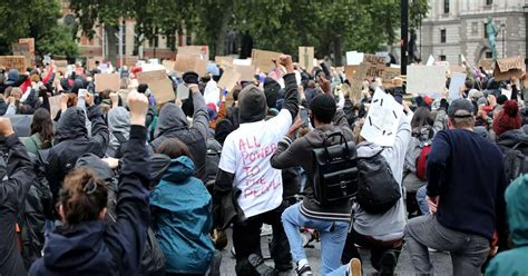 Thousands take the knee for George Floyd in poignant scene at ...