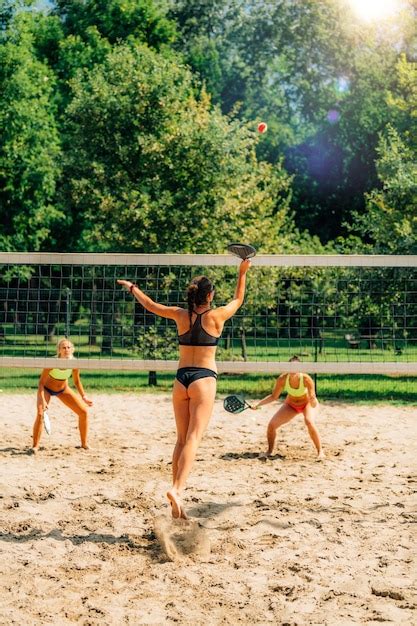 Premium Photo | Beach tennis players at the net