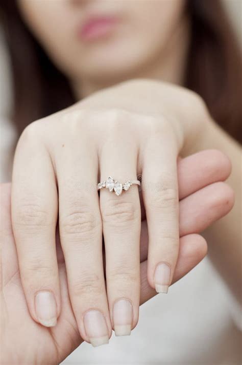 Engagement Ring Into A Finger Stock Images - Image: 18193584