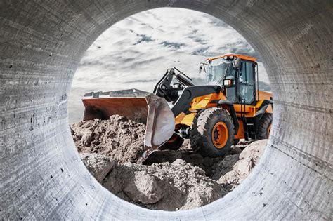 Premium Photo | Bulldozer or loader moves the earth at the construction ...