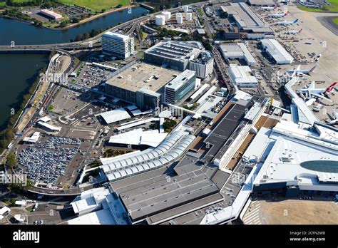 Sydney Airport aerial view with international passengers Terminal 1. Airport parking garages and ...