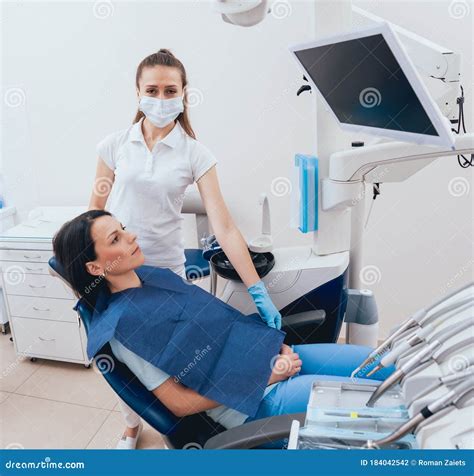 Female Dentist and a Patient at the Dental Office Stock Photo - Image ...