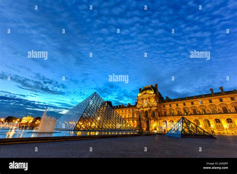 Louvre Museum at night in Paris, France Stock Photo - Alamy