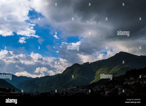 Cloudy mountain landscape Stock Photo - Alamy