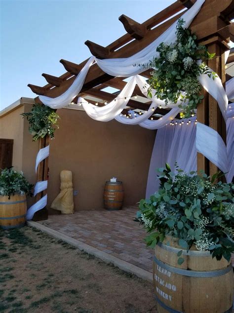 Llano Estacado Winery wedding ceremony under the pergola. Pallet ...