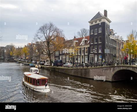 Amsterdam canal with bridge Stock Photo - Alamy