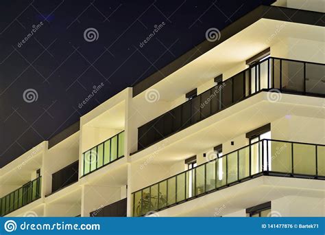 Exterior of Apartment Building at Night Stock Photo - Image of facade, estate: 141477876