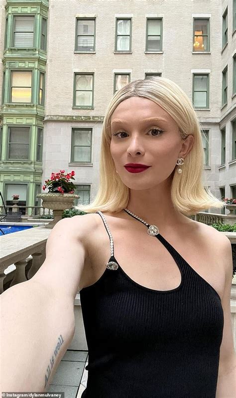 Trans influencer Dylan Mulvaney shows off stunning new platinum hairdo in 90s-style black dress ...