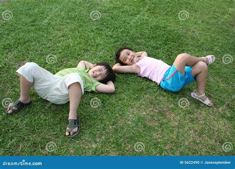 Kids Lying On The Grass Picture. Image: 5622490