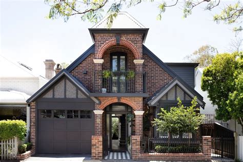 Stunning Brick House with Yellow Shutters: Take a Peek Inside!