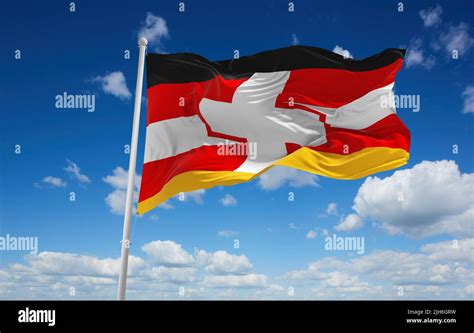 official flag of Austria and Germany, Switzerland Austria at cloudy sky ...