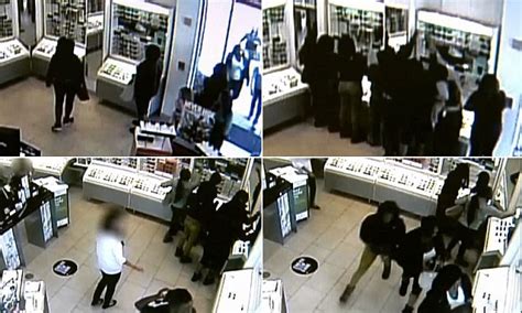 The moment a gang of women raided store in flash mob robbery and made ...