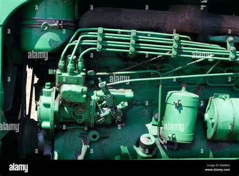 Diesel fuel injection pump on farm tractor engine Stock Photo - Alamy