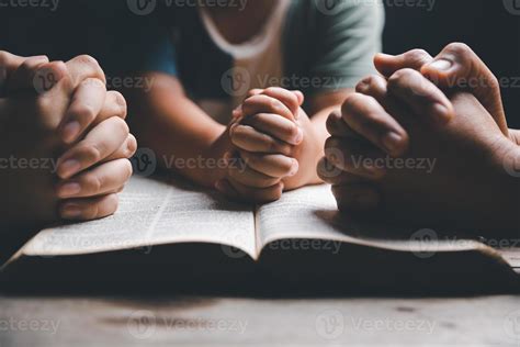 Christian family praying together concept. Child and mother worship God ...