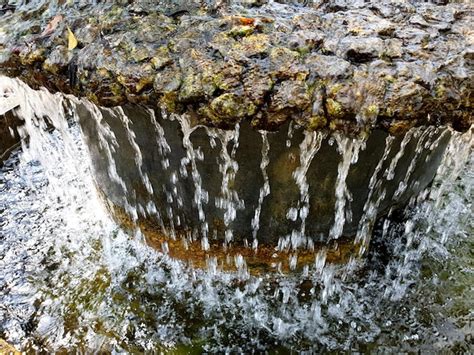 Premium Photo | Small waterfall in the garden