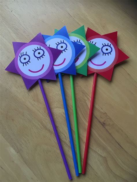 Wands made using plastic lolly sticks (eBay). Wand heads designed in Adobe Illustrator, printed ...