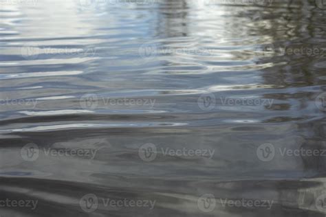 Spring puddle. Texture of water in pond. 13013899 Stock Photo at Vecteezy