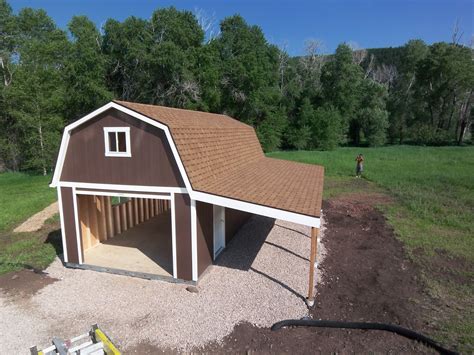 A garage, a loft, and a carport! This Tuff Shed garage has all the space you could need for ...