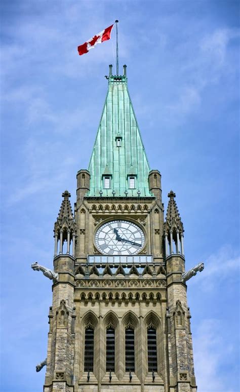 Canadian Flag on a Tower of the Canadian Parliament Building Against a ...