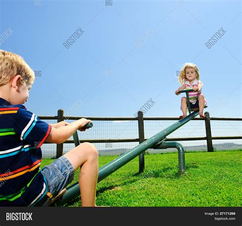 Kids Playing See-saw Image & Photo (Free Trial) | Bigstock