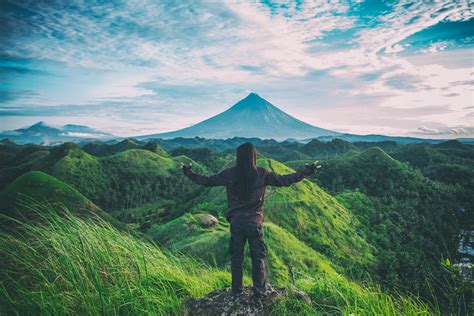 Person Standing on Top Of Hill · Free Stock Photo