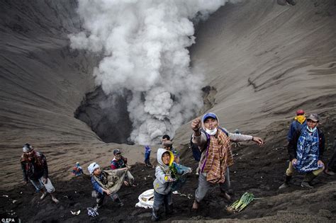 Indonesians throw chickens, goats and money as tribute into the Mount ...