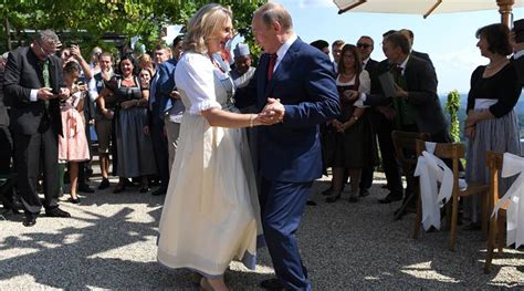 Vladimir Putin dances at Austria wedding before meeting Angela Merkel ...