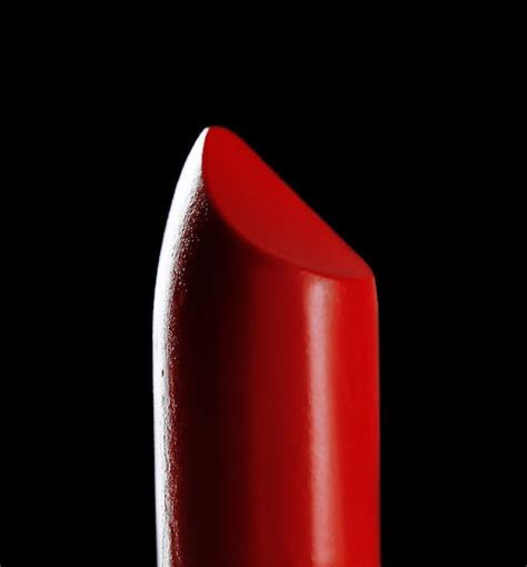 Premium Photo | Red lipstick on black background