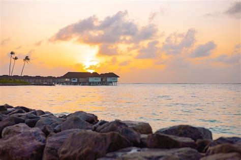 Premium Photo | Picturesque sunrise in the maldive island, view on water villas at sunrise in ...